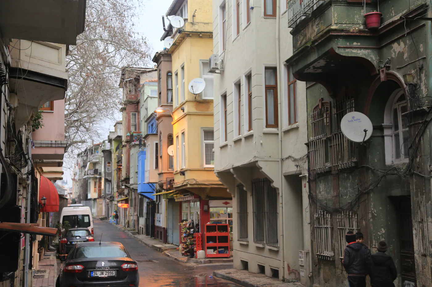 Colourful historic houses standing along a steep street in the Fethiye-Balat area